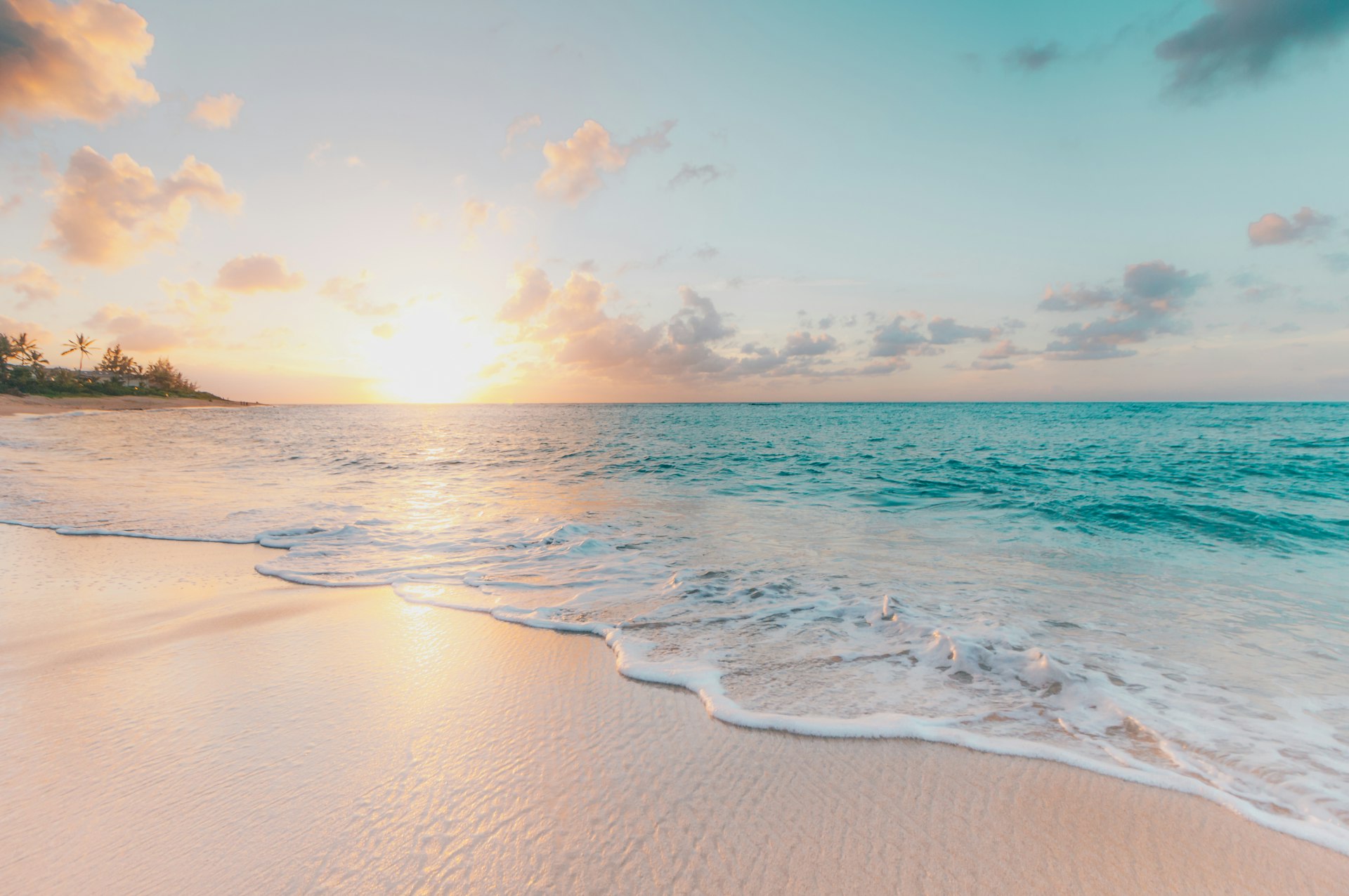 Golden sunset over turquoise Balangan Beach, Bali